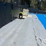 Laying Advanced Tent Technology Tennis Flooring in Adelaide at Memorial Drive