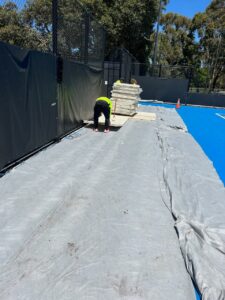 Laying Advanced Tent Technology Tennis Flooring in Adelaide at Memorial Drive